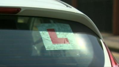 A learner plate in a car
