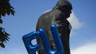 Winston Churchill statue with EU balloon