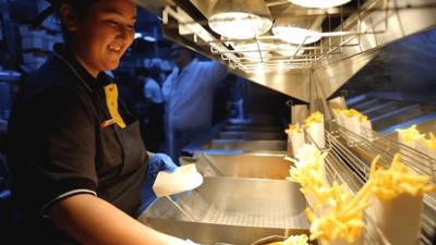 Woman serving fries