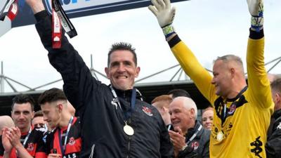 Stephen Baxter lifts the Gibson Cup