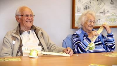 Bert and Enid Fitches playing their ukuleles