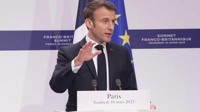 President Macron speaking at a news conference