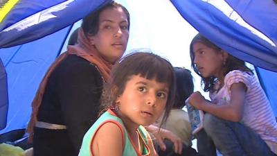 Refugees at a detention centre in Lesbos