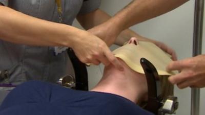 Mask being applied to patient