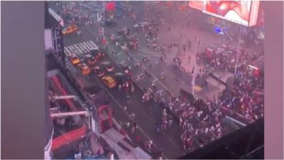 Crowds flee New York tourist attraction after motorbike backfiring is mistaken for an active shooter.