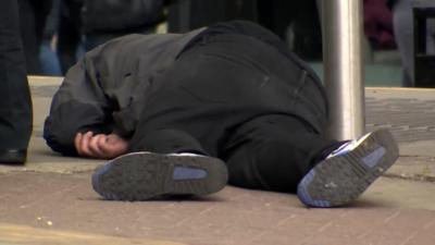 Man passed out in street