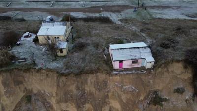 Homes on edge of dunes in Hemsby, Norfolk