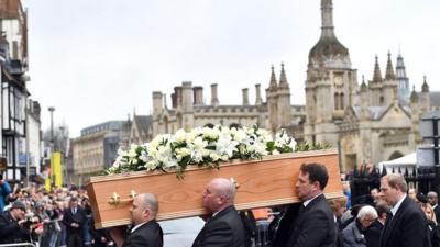 Pallbearers carry Stephen Hawking's coffin