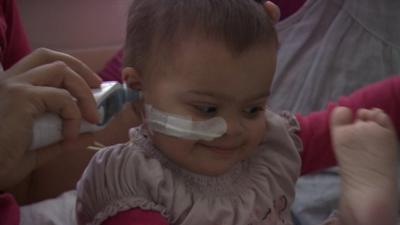 Baby having ear checked in hospital