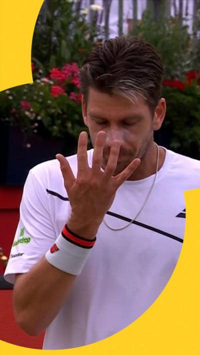 Cameron Norrie waves his hand in front of his face, emulating John Cena