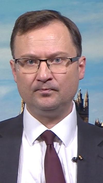 Man in glasses with burgundy tie
