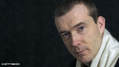 Author David Mitchell poses for a portrait.