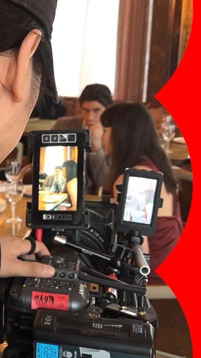 Person shooting a micro-drama in a restaurant 