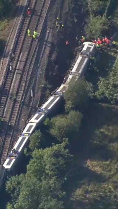 Aerial view of train that has come off the tracks 