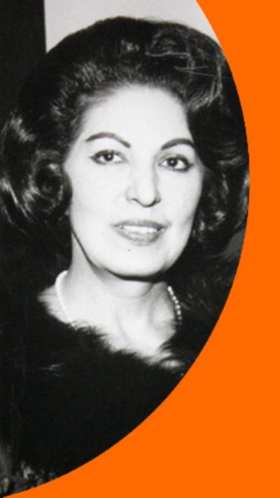 A black and white photo of Consuelo Velazquez in which she has dark curly hair.
