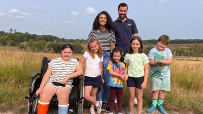 Nina with Adam Bolton and 5 children