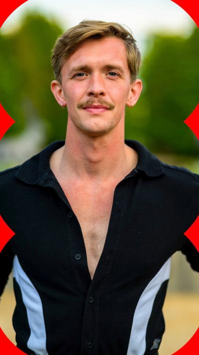 Stephen from the Traitors looking at the camera