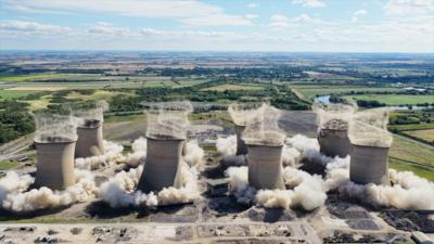 Eight cooling towers collapse together