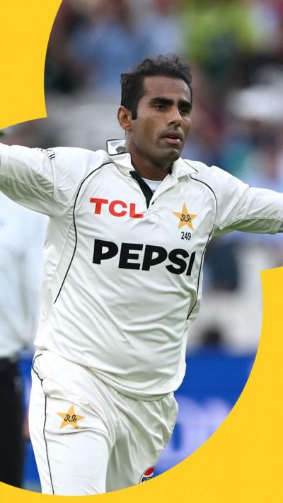 Mohammad Ali stretches his arms out in celebration after taking a wicket