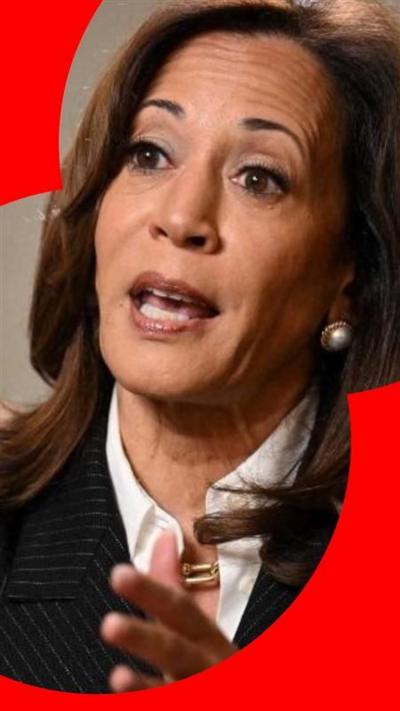 Kamala Harris, with shoulder length dark hair, looking to the side.