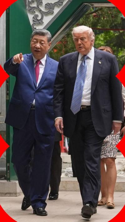 Xi and Trump walk through Zhongnanhai garden.