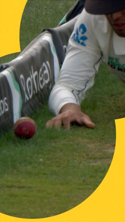Rachin Ravindra crawls after the ball as it hits the boundary on day four of England v New Zealand's Test series