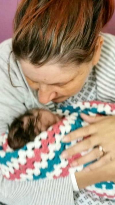 Sarah Andrews holding her baby, Wynter