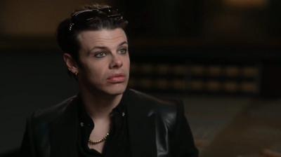 Yungblud looks at the camera with a serious expression 
