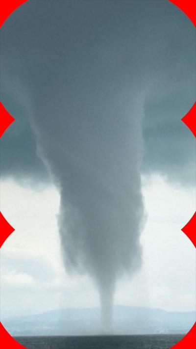 A large waterspout swirls above a lake in Germany.
