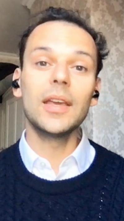 An MP sits in their home office recording a video call interview