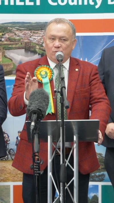 Lindsay Whittle in a red blazer and a Plaid Cymru rosette