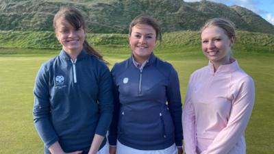 Three sisters on a golf course