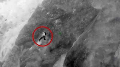 Man clinging from cliff in California