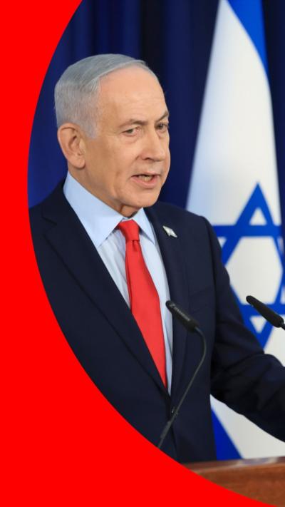 Israeli Prime Minister Benjamin Netanyahu stood next to an Israeli flag