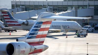  American Airlines regional jets park at the Reagan National Airport runway on 30 JAnuary, as the investigation continues