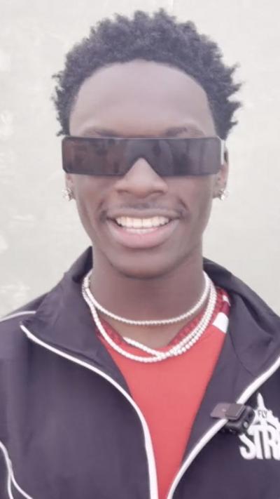 Rapper LeoStayTrill in sunglasses smiling