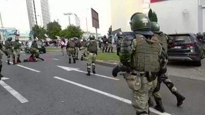 Riot police chasing demonstrators