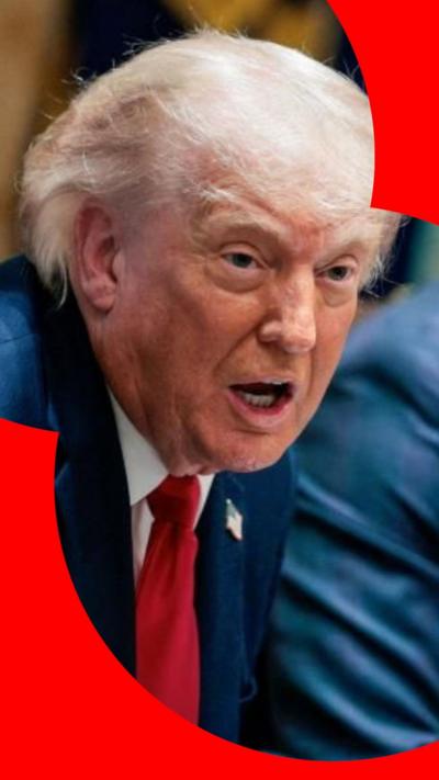 Donald Trump setting and talking to someone out of shot