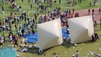 Fans pulling down tents in Salt Lake stadium
