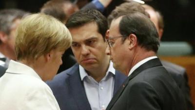 Greek Prime Minister Alexis Tsipras (C) talks with German Chancellor Angela Merkel (L) and French President Francois Hollande