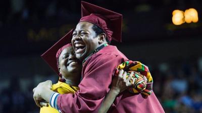 Sharonda and Stephan Wilson hug at graduation