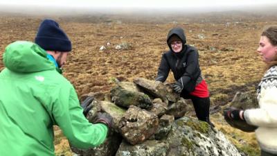 Brown Group volunteers build a cairn