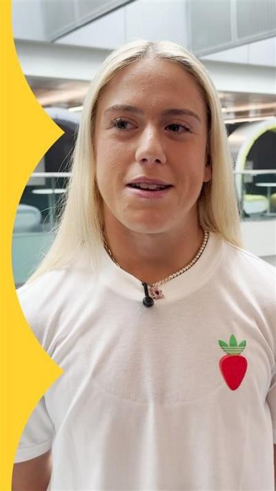Sonay Kartel, with long blonde hair, wearing white t-shirt with strawberry addidas logo on her left.