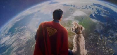 Superman and his dog looking out over earth 