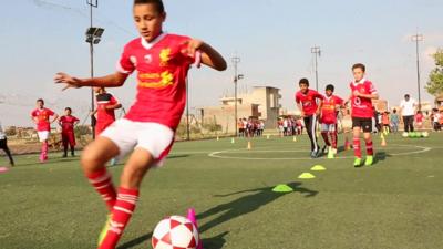 Children playing football