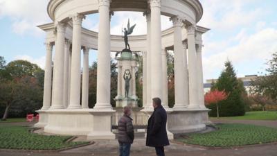 Dafydd and his dad looking at a cenotaph