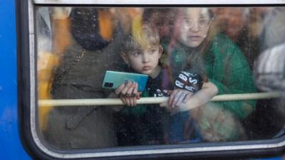 Child in train window in Ukraine