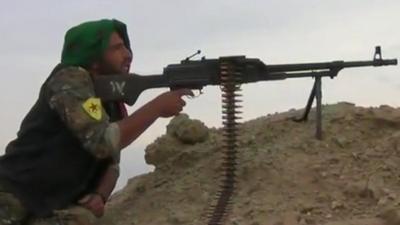 Man using a machine gun during a battle in Turkey