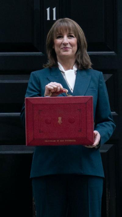 Chancellor of the Exchequer Rachel Reeves poses outside 11 Downing Street, London, with her ministerial red box 