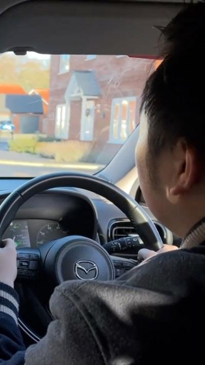 Yin Cheong William Shen driving in his instructor's car